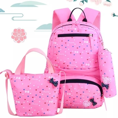 Las mochilas para las muchachas enseñan a niños lindos hacen excursionismo la fiambrera aislada Bookbags fijaron el bolso